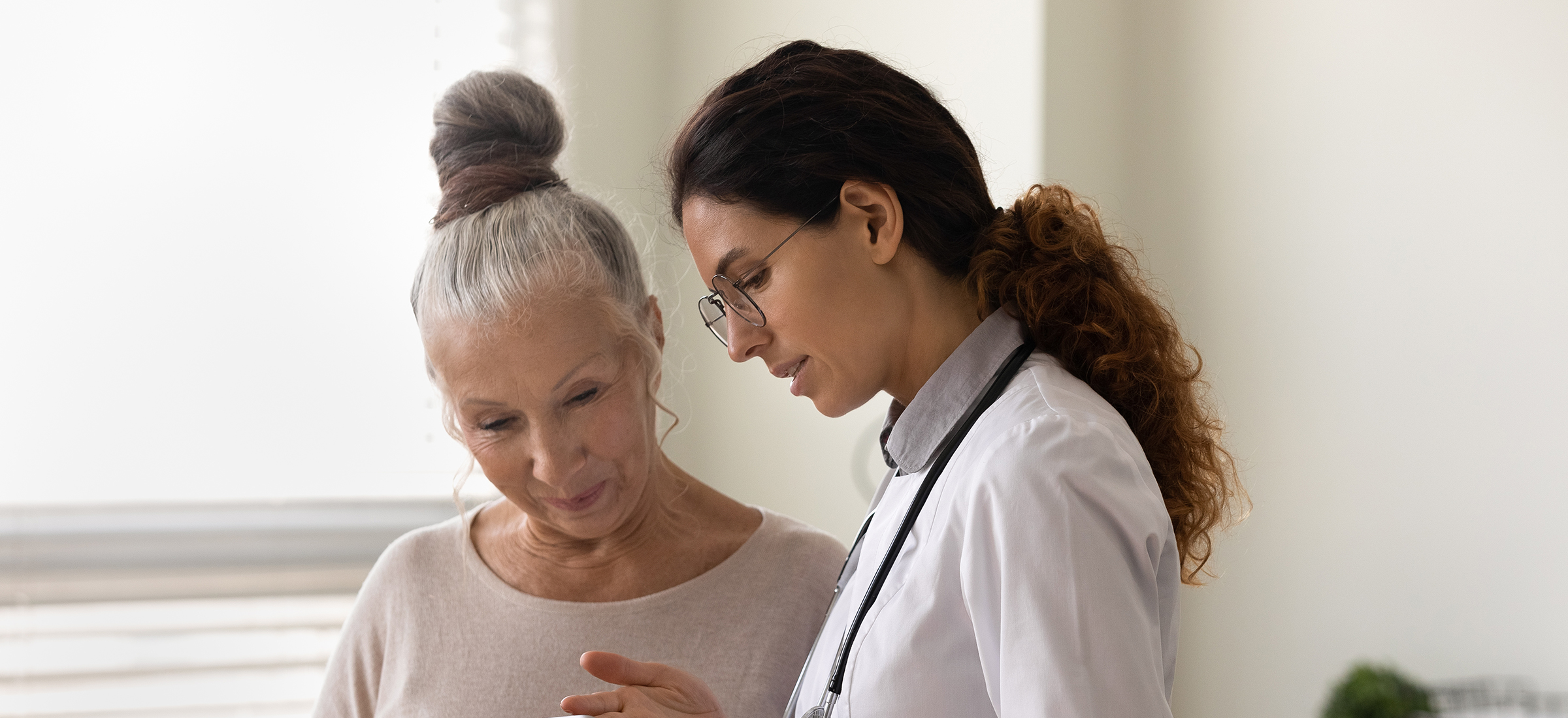 Caring doctor talking to a patient